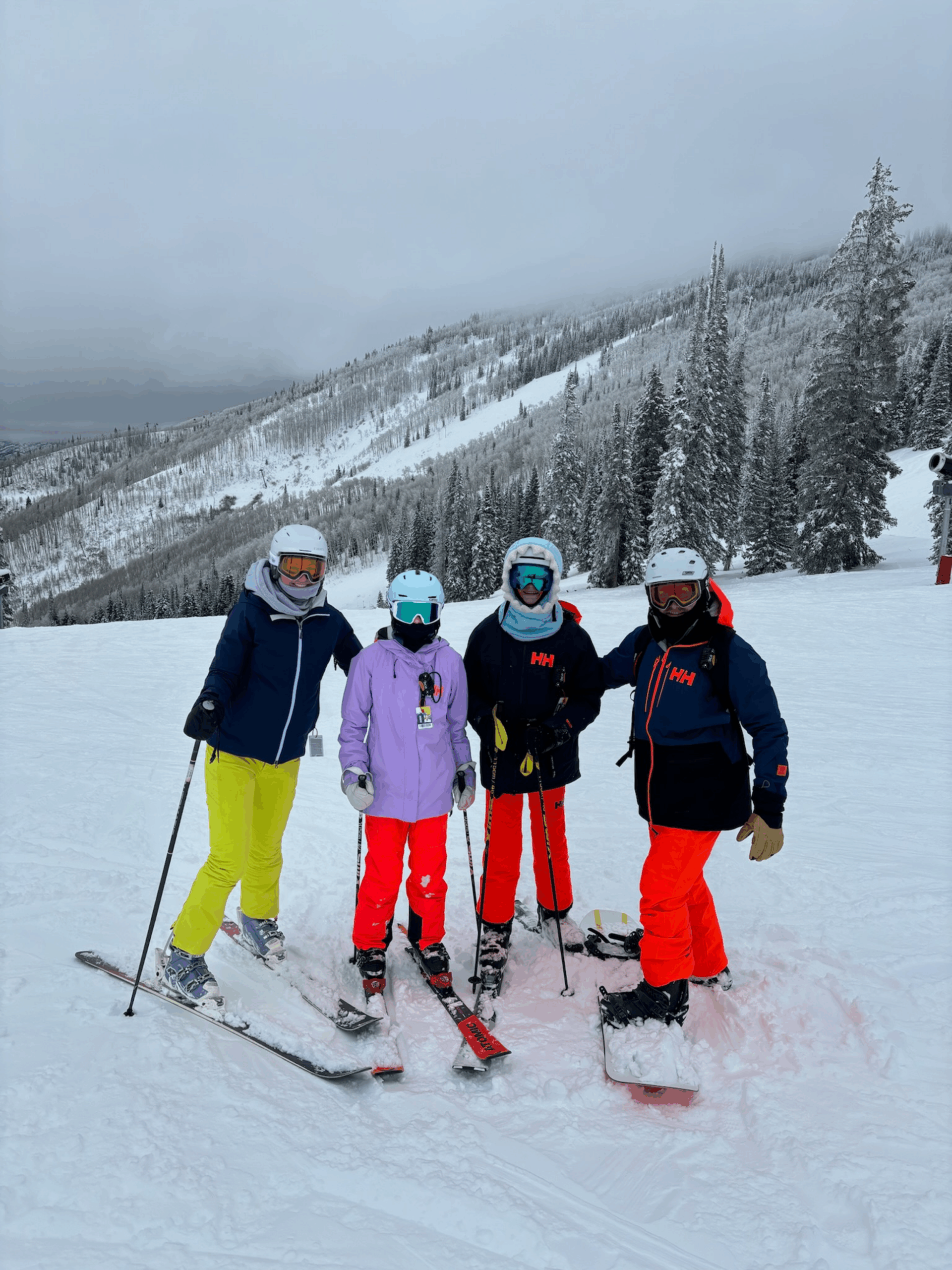 Family skiing in snowy mountains